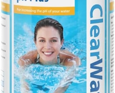 a woman swimming in a pool with a blue lid