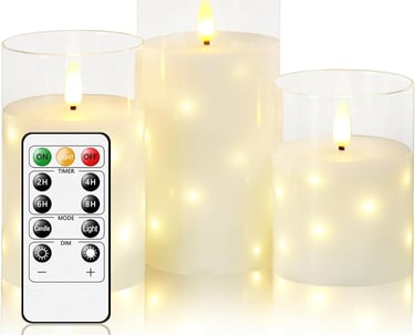 a group of candles with remote control