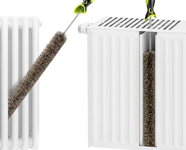 a pair of scissors and a brush brush on a white radiator