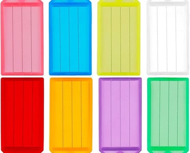 A set of eight colorful plastic key tags with metal split rings and white ID labels for easy organization.