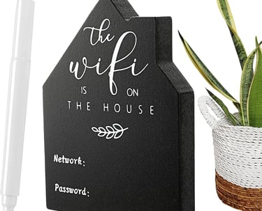 a house with a plant in a potted planter