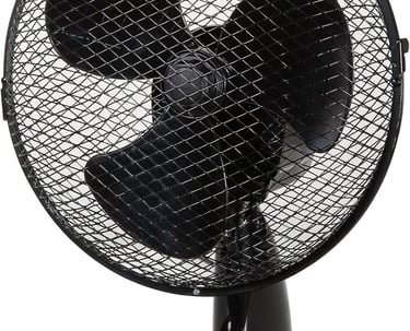 a fan on a table top with a fan