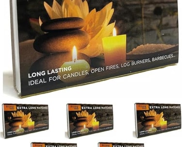 a box of extra long lasting candles with candles