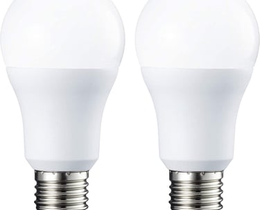 a pair of white light bulbs on a white background