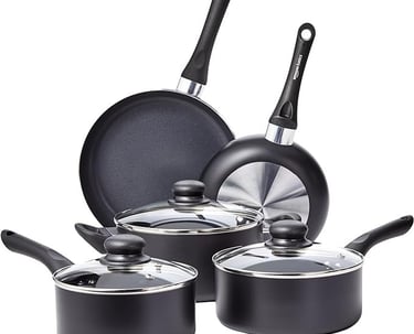 a set of pots and pans with pots and pans