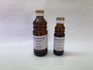 große und kleine braune Öl-Flasche: Schwarzkümmelöl