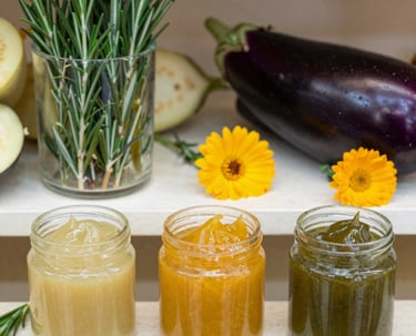 Bottles of natural tinctures with wooden labels on a rustic wooden table with green leaves