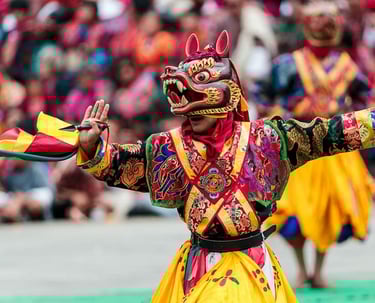 Dancer_potraying_meaningful_hand_gestures_during_annual_religious_masked_dance_festival_in_Thimphu