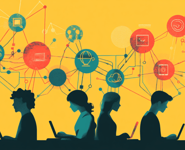 a group of people sitting at a table with laptops