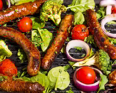 Sustainable plant-based, nutritionally-dense, hypoallergenic protein and fibre sausages with vegetables surrounding