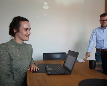Business professionals collaborating in an office during a funding meeting.