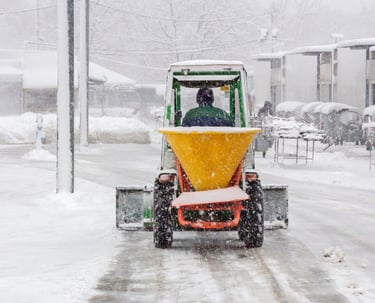 a man cleaning snow