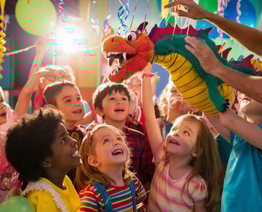 children at children's party with puppet presentation