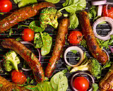 Sustainable plant-based, nutritionally-dense, hypoallergenic protein and fibre sausages with vegetables surrounding