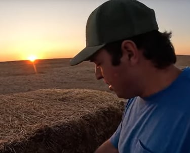 a man in a blue shirt and a hat