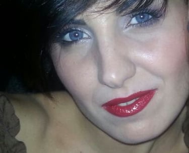a woman with a red lipstick and a black jacket
