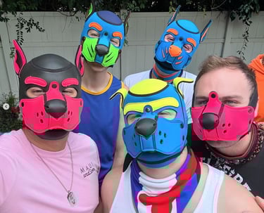 Five men posing in colorful pup masks.