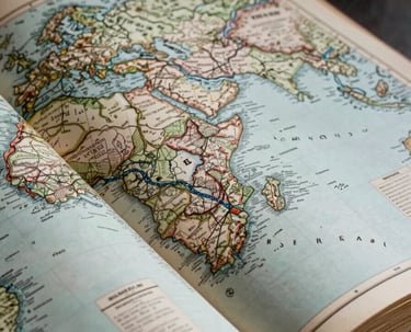 Extreme close-up of a vintage geopolitical atlas spread open, cool overhead studio lighting revealing hand-inked borders and territorial annotations, cartographic grid lines and faded legend text visible in the lower third, deep shadows framing the pages, no people