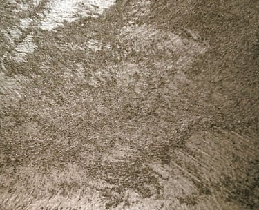 A warm silver paint sample showing its lustre and beautiful grainy texture.