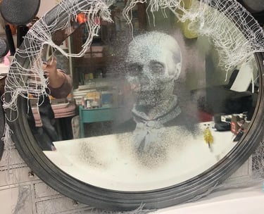 a mirror with a creepy ghost