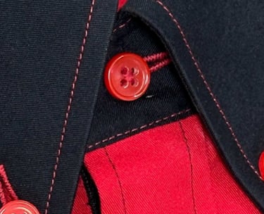 a red shirt with black and red buttons