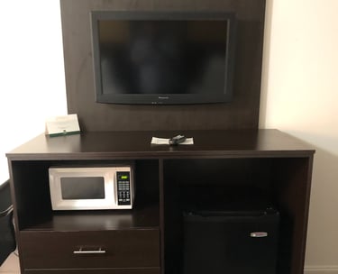 a microwave and a refrigerator in a room