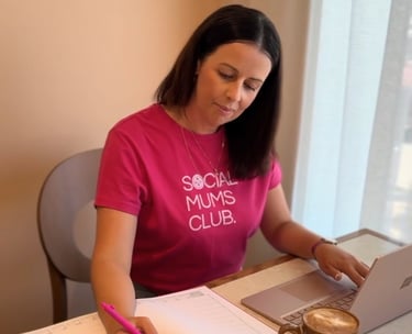 Content creator planning digital marketing and workshop notes while working at a laptop