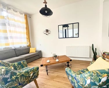 Cozy lounge with TV and sofa for business travelers on mid-term stays