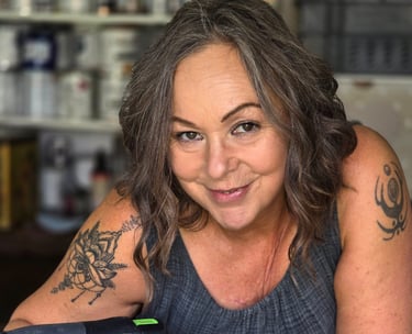 Owner of Absolutely Mintage - Julia -  holds a Festool sander