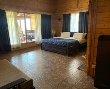 Comfortable bedroom in a mountain homestay in Chikmagalur