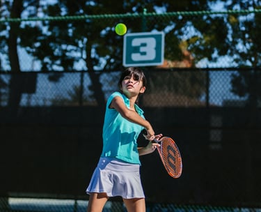 a girl playing tennis