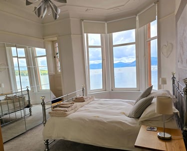 A large bedroom at Gourock Seaview Holiday Let with a view of the sea