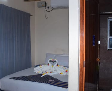 AC room at Hotel Aishwariyam Thirukadaiyur hotel near Abirami Temple with clean and comfortable stay