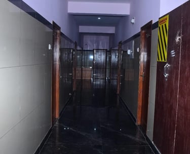 Clean and well maintained corridor at Hotel Aishwariyam Thirukadaiyur hotel near temple