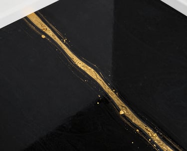 Decorative resin flooring black base with a gold veins in a bright commercial space.