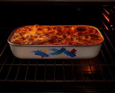Golden brown cheesy lasagna baking in a ceramic casserole dish inside a modern oven.