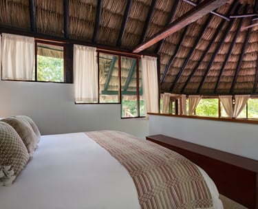 thatched roof and large bed 