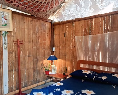 a bed with a blue bedding and a wooden bed