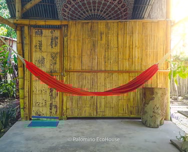 a hammock with a red hammock on it