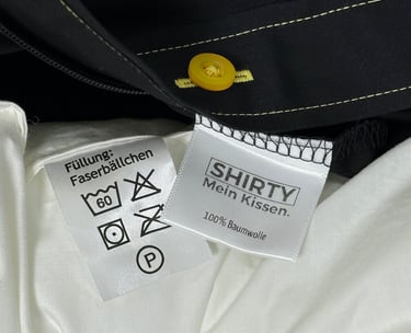 care label of a shirt and pillow