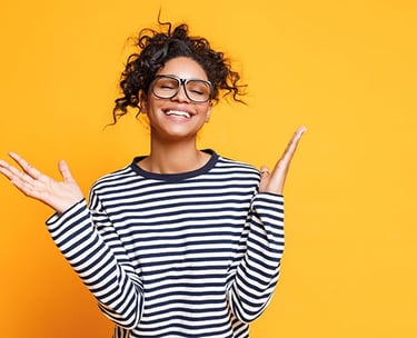 a smiling woman with glasses and a striped shirt