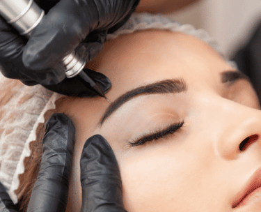 a woman getting her eyebrows done by a professional hairdresser
