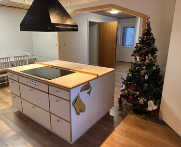 a kitchen with a christmas tree 