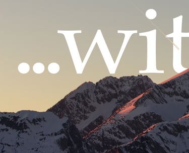 Snow-capped mountain peaks at sunset with white text overlay reading with.