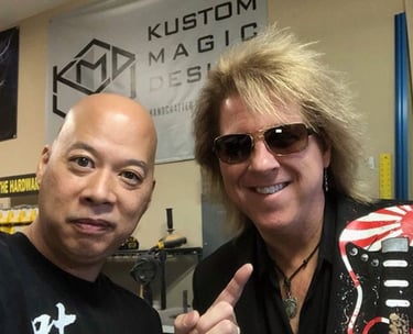 Ray Lum and David Starr posing at Kustom Magic Design, David Starr with sunglasses