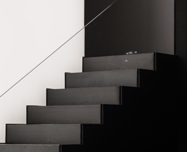 a man is standing on a staircase casement