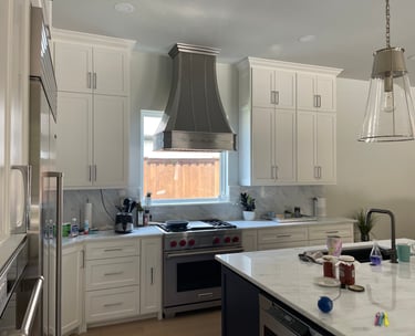 a kitchen with a stove top oven and a stove top