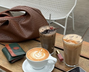 a table with a phone and a purse