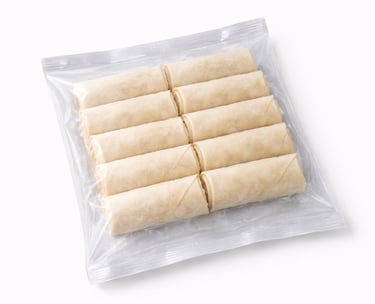 Frozen vegetable spring rolls packed for quick frying and wholesale markets