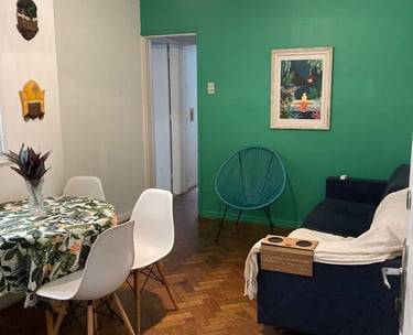 a dining room with a table and chairs